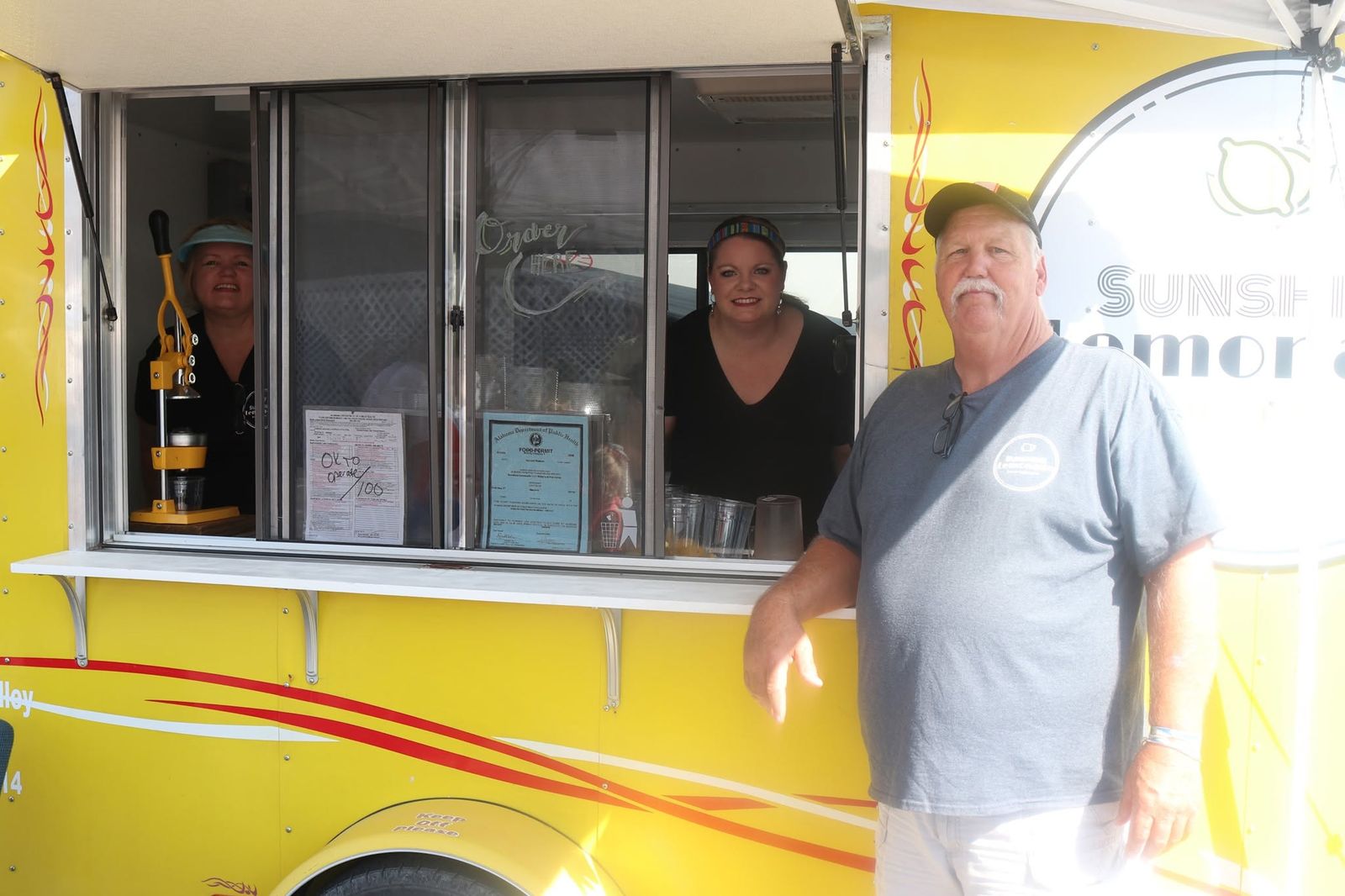 A festival food truck serving customers