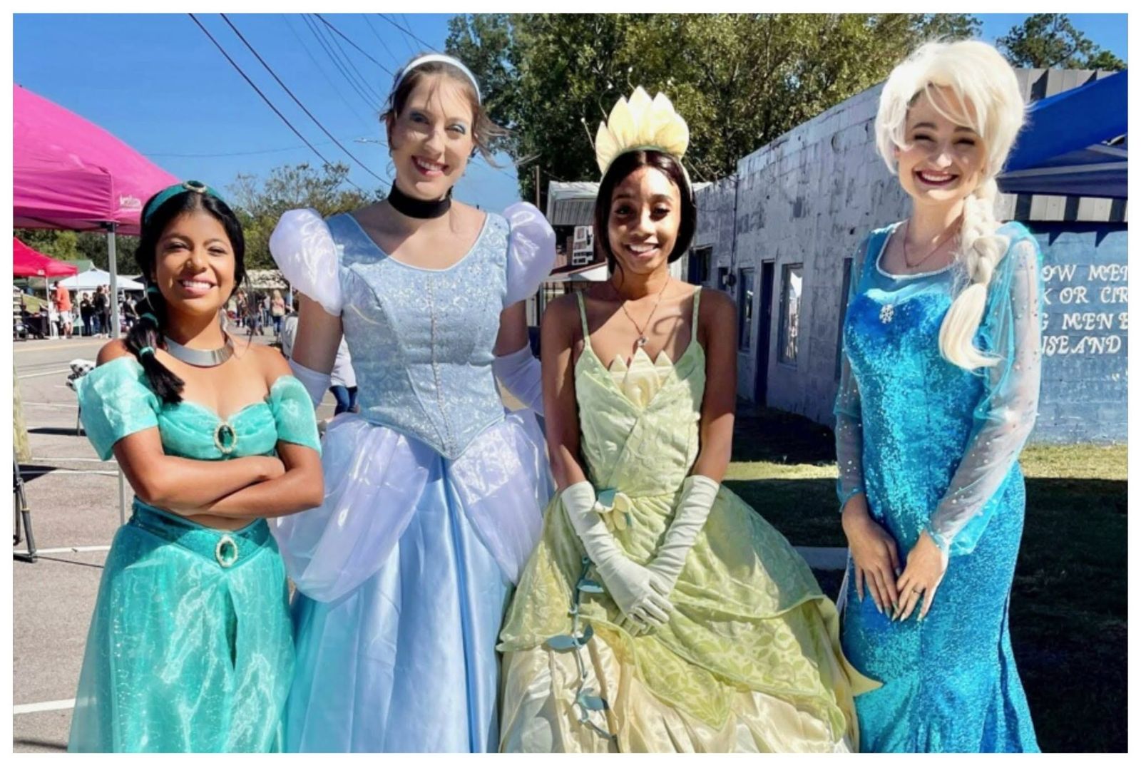 Storybook princesses greeting families at the festival