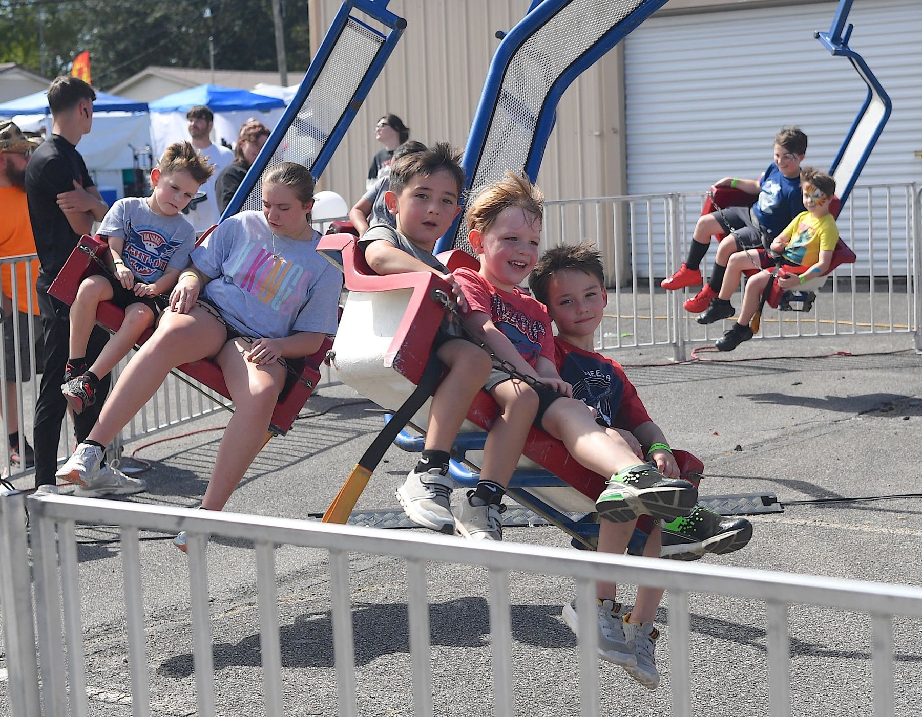 Kids laughing on the swing ride